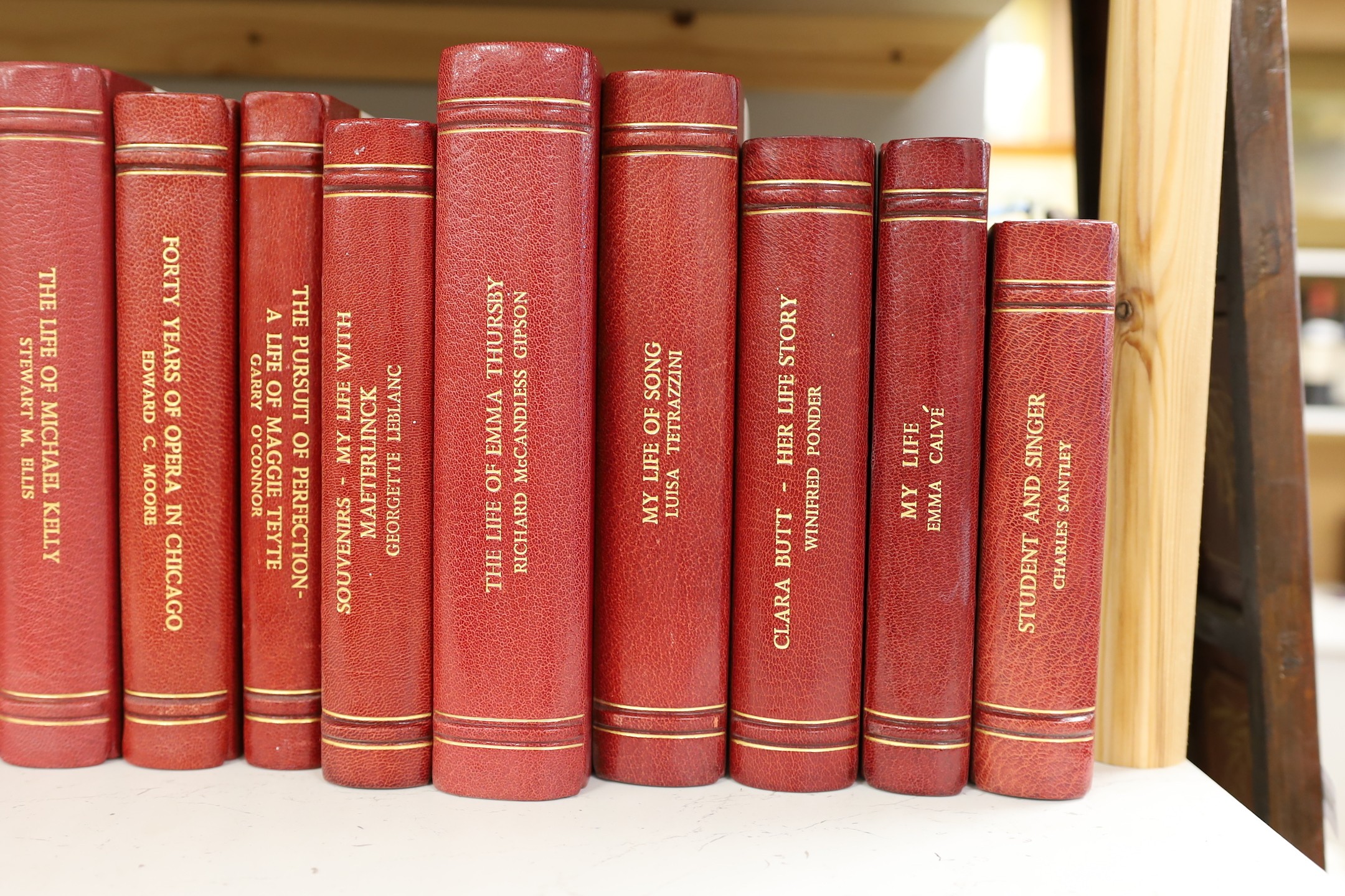 A collection of 19th and 20th century works on opera related biographies, autobiographies and histories, bound in red morocco by EA Weeks, London, approx 66 altogether